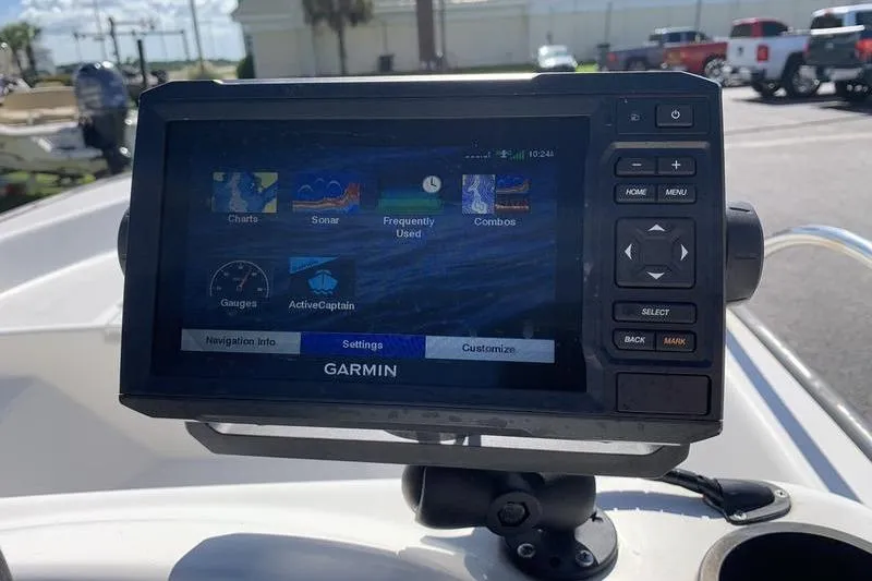 Slide: The Image of Garmin navigation system on a 2007 Boston Whaler 130 Sport boat dashboard. - 12