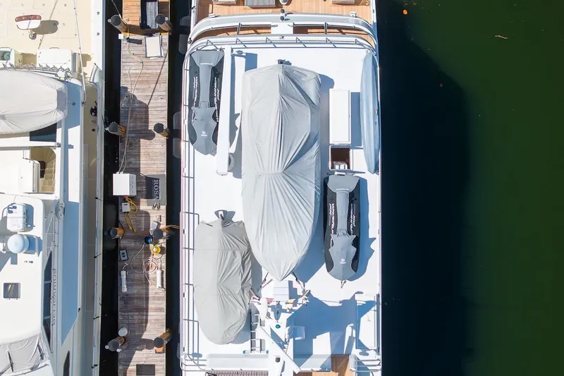 Slide: The Image of Aerial view of 1996 ABD 90 Explorer yacht docked with covered equipment. - 20
