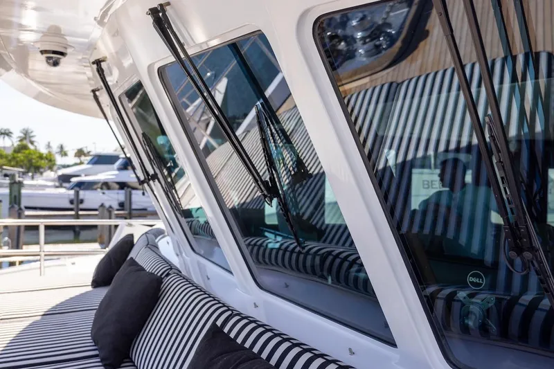 Slide: The Image of Luxury yacht with striped seating, featuring sleek windows and modern design elements. - 29
