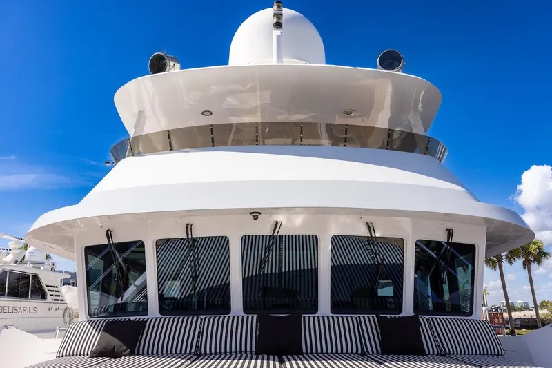 Slide: The Image of Luxury yacht ABD 90 Explorer, 1996 model, with sleek design and striped seating. - 32