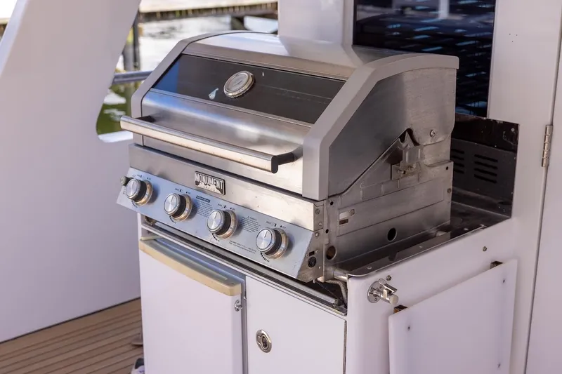 Slide: The Image of Stainless steel grill on ABD 90 Explorer yacht, 1996 model, with four control knobs. - 37