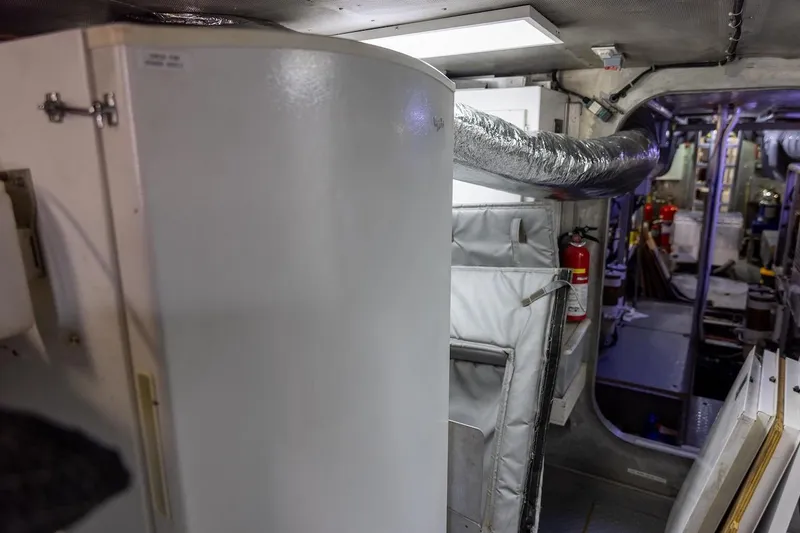 Slide: The Image of Interior of a 1996 ABD 90 Explorer yacht, featuring equipment and safety gear. - 40