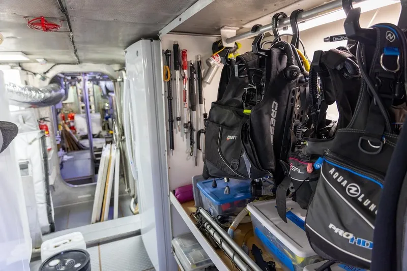 Slide: The Image of Diving equipment storage inside 1996 ABD 90 Explorer yacht, featuring organized gear and tools. - 41