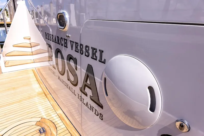 Slide: The Image of Research vessel "Rosa" docked, featuring wooden deck and sleek design, ABD 90 Explorer 1996. - 45