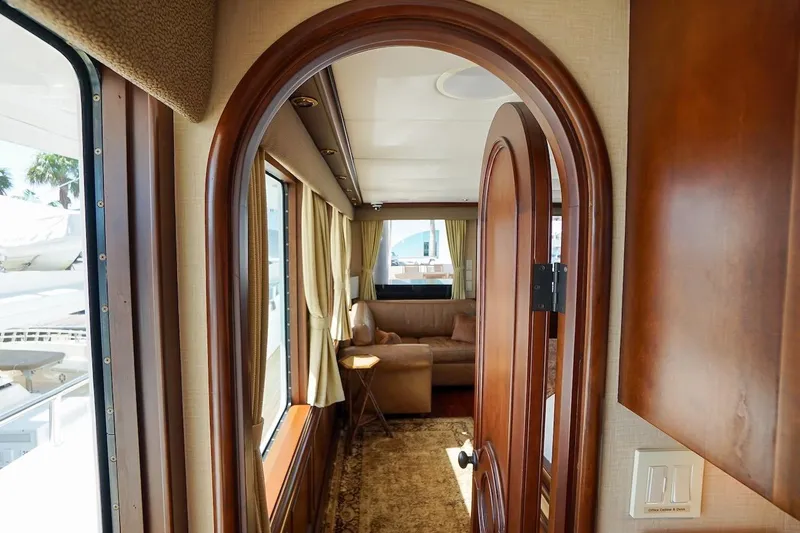 Slide: The Image of Interior of 1996 ABD 90 Explorer yacht with elegant wood finishes and cozy seating area. - 53