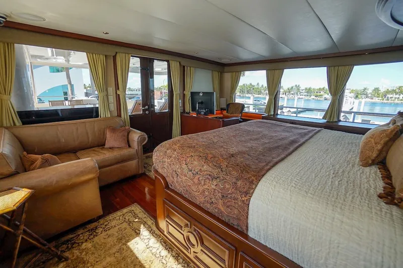 Slide: The Image of Luxurious 1996 ABD 90 Explorer yacht interior with elegant bedroom and scenic window views. - 54
