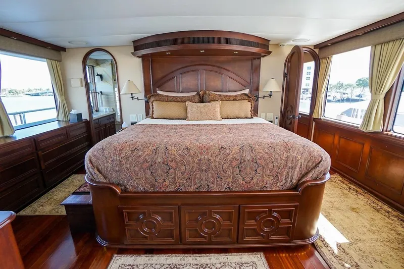 Slide: The Image of Luxurious bedroom interior on 1996 ABD 90 Explorer yacht with elegant wood finishes. - 55