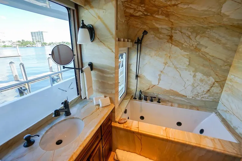 Slide: The Image of Luxurious marble bathroom on 1996 ABD 90 Explorer yacht with waterfront view. - 58