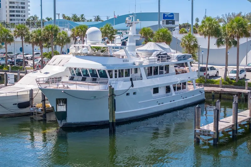 Slide: The Image of Luxury yacht ABD 90 Explorer 1996 docked at marina with palm trees. - 6