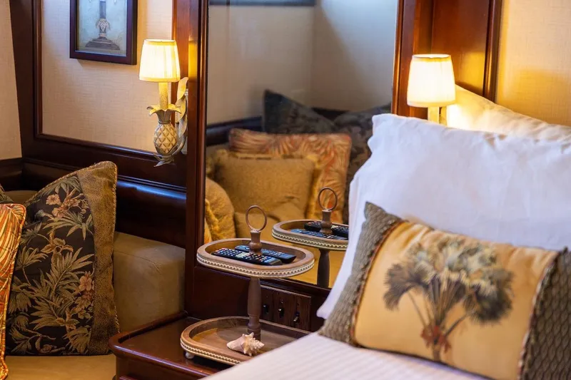 Slide: The Image of Luxurious bedroom interior with elegant pillows, soft lighting, and a decorative mirror. - 70