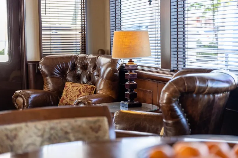 Slide: The Image of Luxurious leather seating area with lamp, inside 1996 ABD 90 Explorer yacht. - 73