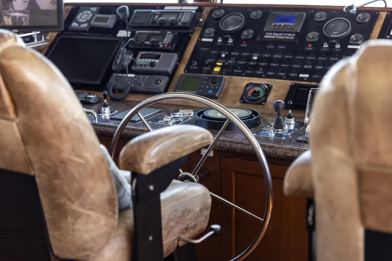 Slide: The Image of Pilot cabin of 1996 ABD 90 Explorer yacht with steering wheel and control panels. - 75