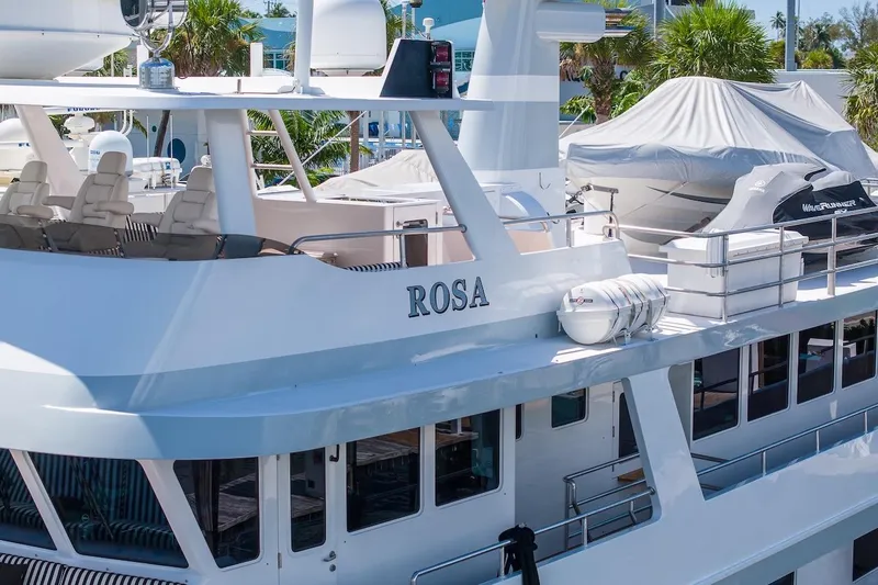 Slide: The Image of Luxury yacht "ROSA" docked, featuring sleek design and modern amenities, ABD 90 Explorer 1996. - 8