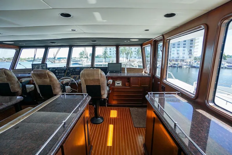 Slide: The Image of Interior of 1996 ABD 90 Explorer yacht with panoramic windows and luxurious seating. - 82