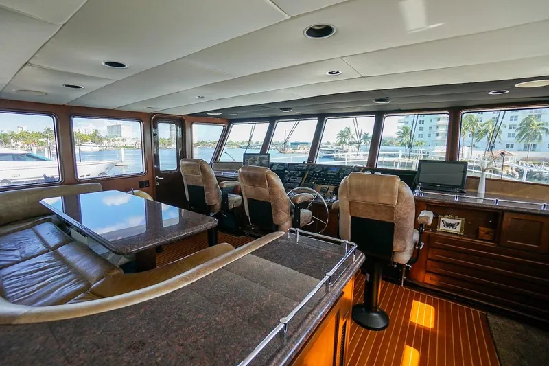 Slide: The Image of Luxurious interior of 1996 ABD 90 Explorer yacht with panoramic windows and plush seating. - 83