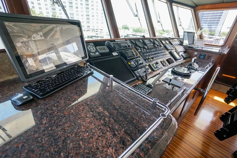 Slide: The Image of Control room of 1996 ABD 90 Explorer yacht with navigation equipment and monitors. - 85