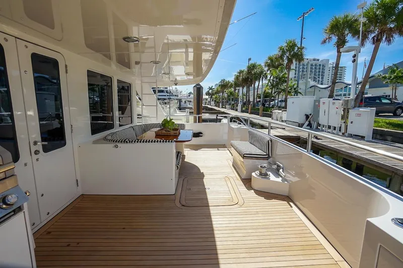 Slide: The Image of Luxurious 1996 ABD 90 Explorer yacht deck with seating and modern amenities. - 97