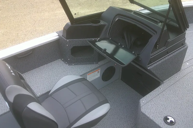 Slide: The Image of 2026 Lund 1800 Explorer Sport boat interior with seating and storage compartments. - 14