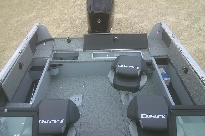 Slide: The Image of 2026 Lund 1800 Explorer Sport boat interior with seating and storage compartments. - 15