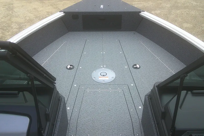 Slide: The Image of 2026 Lund 1800 Explorer Sport boat interior with spacious deck and storage compartments. - 5