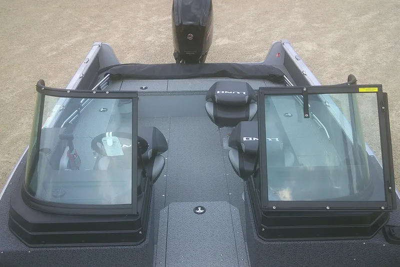 Slide: The Image of 2026 Lund 1800 Explorer Sport boat interior with dual windshields and seating. - 8