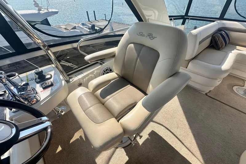 Slide: The Image of Captain's chair on 2014 Sea Ray 450 Sedan Bridge yacht, overlooking marina. - 13