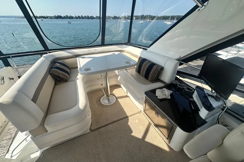 Slide: The Image of Luxurious interior of 2014 Sea Ray 450 Sedan Bridge yacht with seating and ocean view. - 14
