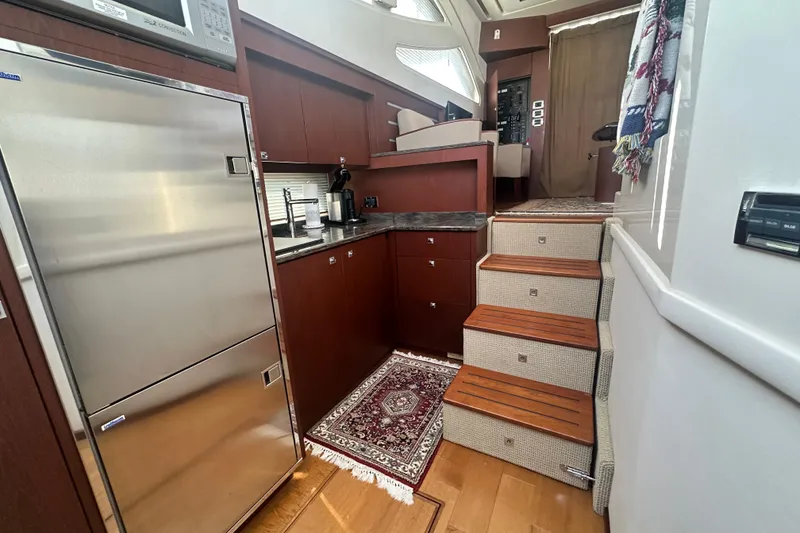 Slide: The Image of Luxurious interior of 2014 Sea Ray 450 Sedan Bridge yacht kitchen area. - 33