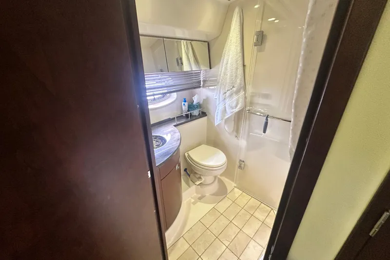 Slide: The Image of Bathroom interior of 2014 Sea Ray 450 Sedan Bridge yacht, featuring modern amenities. - 48