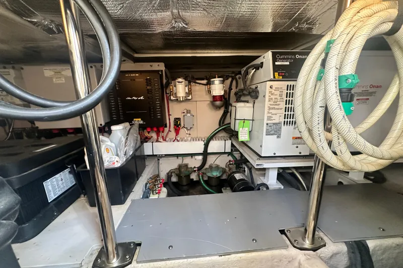 Slide: The Image of Engine room of 2014 Sea Ray 450 Sedan Bridge with Cummins Onan generator. - 60