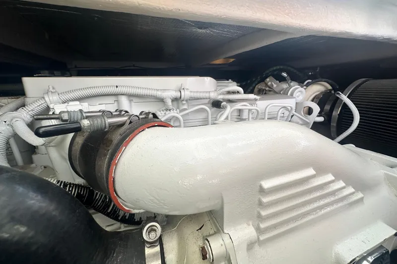 Slide: The Image of Engine compartment of 2014 Sea Ray 450 Sedan Bridge yacht, showcasing detailed components. - 61