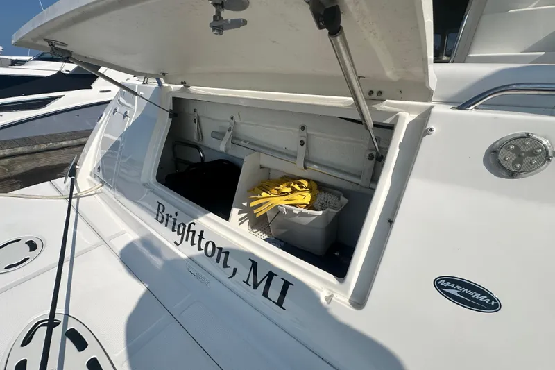 Slide: The Image of 2014 Sea Ray 450 Sedan Bridge yacht storage compartment open, docked in Brighton, MI. - 70