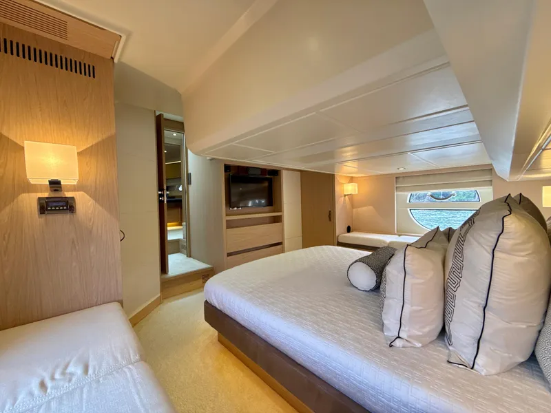 Slide: The Image of Luxurious cabin interior of 2017 Beneteau Monte Carlo 5S yacht, featuring elegant bedding and lighting. - 11
