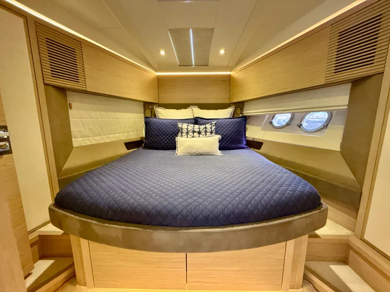 Slide: The Image of Luxurious cabin interior of 2017 Beneteau Monte Carlo 5S yacht with elegant bedding. - 15