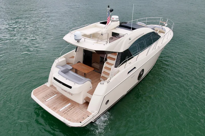 Slide: The Image of 2017 Beneteau Monte Carlo 5S yacht cruising on calm waters, rear view. - 36