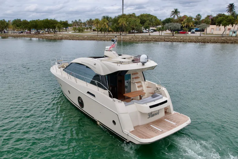 Slide: The Image of 2017 Beneteau Monte Carlo 5S yacht cruising in calm waters, rear view. - 37