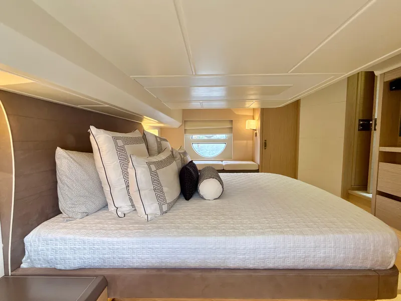 Slide: The Image of Luxurious bedroom interior of 2017 Beneteau Monte Carlo 5S yacht, featuring elegant bedding and modern design. - 4