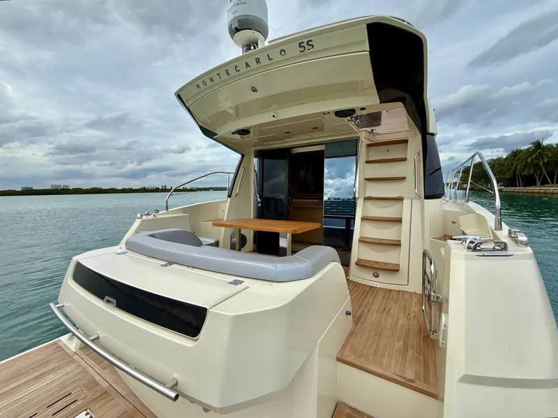 Slide: The Image of 2017 Beneteau Monte Carlo 5S yacht with elegant deck and seating area. - 5
