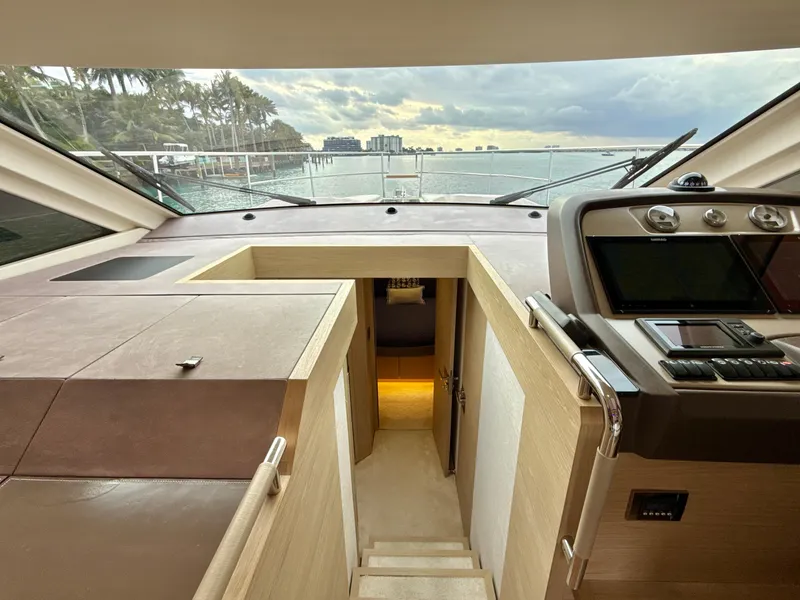 Slide: The Image of Interior view of 2017 Beneteau Monte Carlo 5S yacht, featuring helm and cabin entrance. - 7