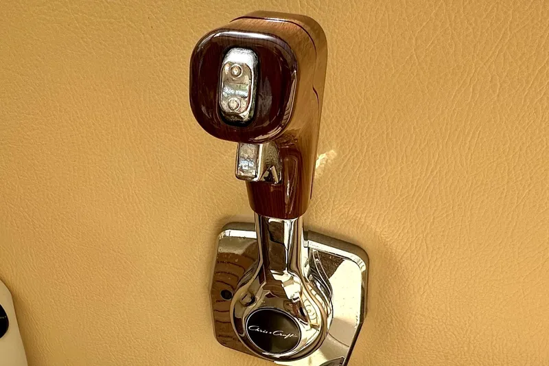 Slide: The Image of Chrome throttle lever on 2013 Chris-Craft Corsair 22 boat interior. - 18