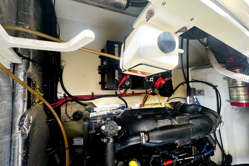 Slide: The Image of Engine compartment of a 2013 Chris-Craft Corsair 22 boat, showing wiring and components. - 20
