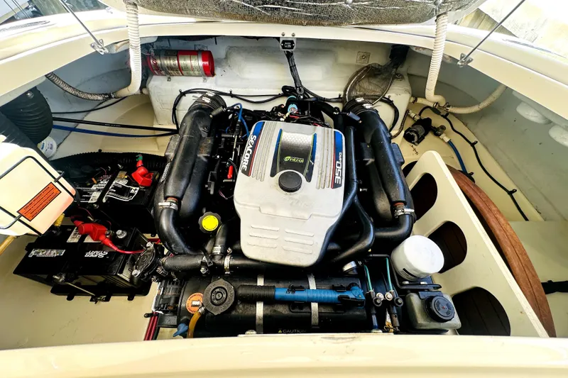 Slide: The Image of Engine compartment of a 2013 Chris-Craft Corsair 22 boat, featuring a powerful 350 MAG engine. - 21