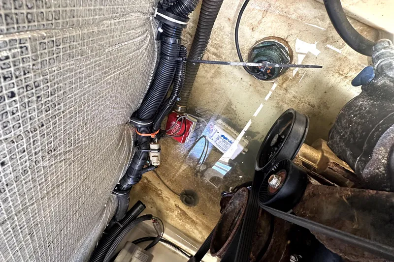 Slide: The Image of Engine compartment of 2013 Chris-Craft Corsair 22 with visible wiring and components. - 24