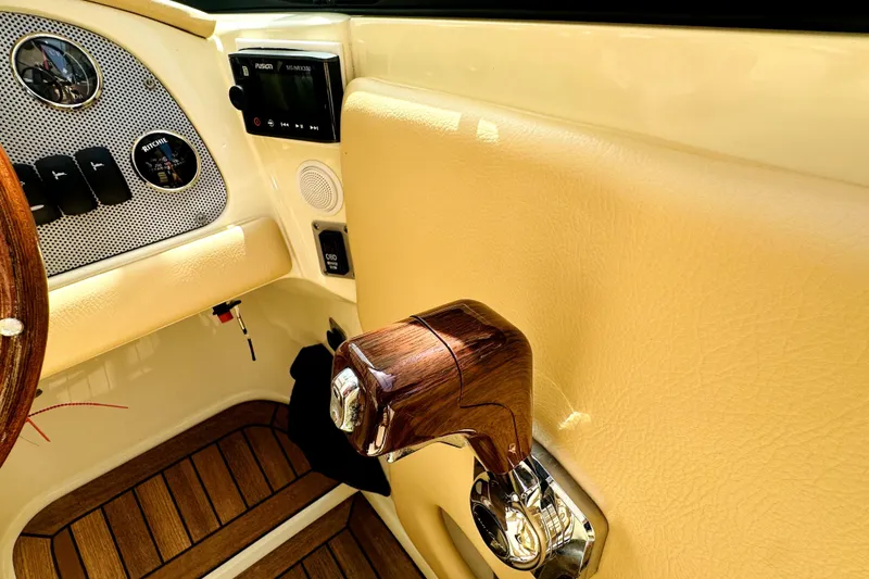 Slide: The Image of Interior of 2013 Chris-Craft Corsair 22 boat, featuring dashboard and controls. - 5