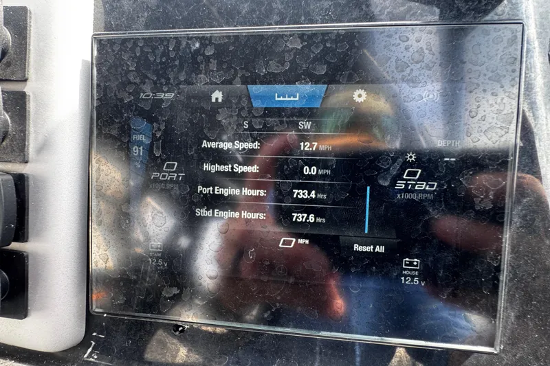 Slide: The Image of Dashboard of a 2023 Yamaha Boats AR220 showing engine hours and speed metrics. - 12