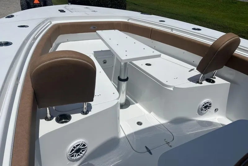 Slide: The Image of 2026 Sea Hunt Gamefish 30 Forward Seating with table and cushioned seats. - 13