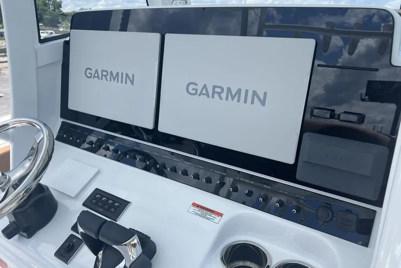 Slide: The Image of Control panel of 2026 Sea Hunt Gamefish 30 with dual Garmin displays. - 19