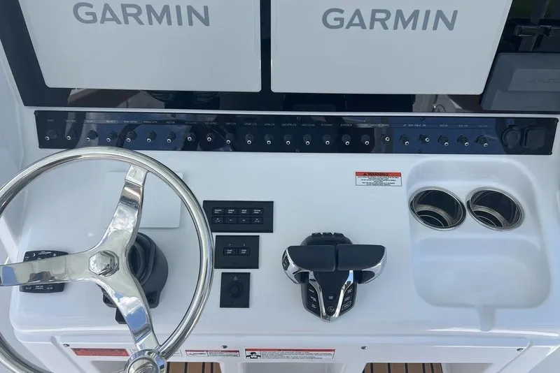 Slide: The Image of 2026 Sea Hunt Gamefish 30 helm with Garmin displays and controls. - 20