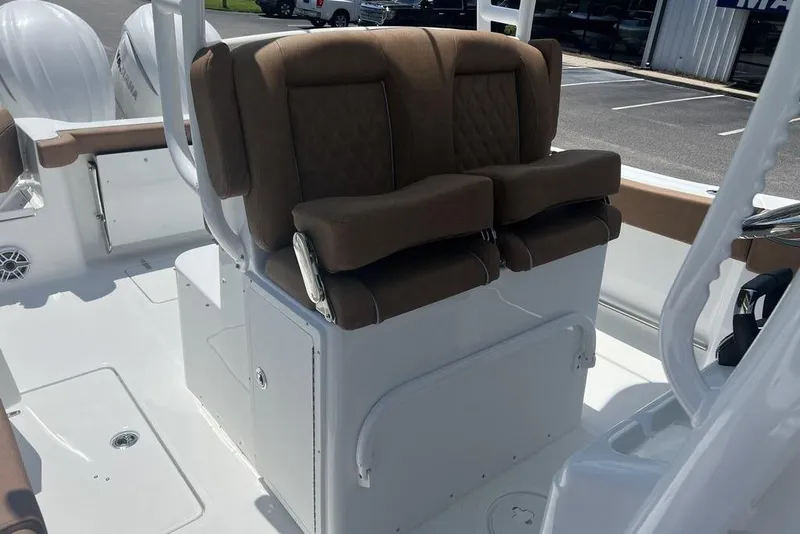 Slide: The Image of 2026 Sea Hunt Gamefish 30 Forward Seating with brown cushioned seats and white deck. - 21