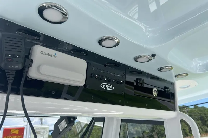 Slide: The Image of 2026 Sea Hunt Gamefish 30 dashboard with Garmin electronics and modern controls. - 24